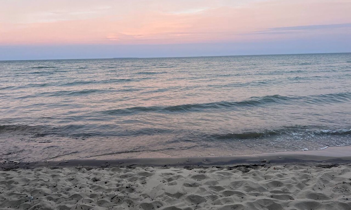 Au Gres House | Enjoy a Lake Huron view less than a minute walk to the beautiful sandy beach.