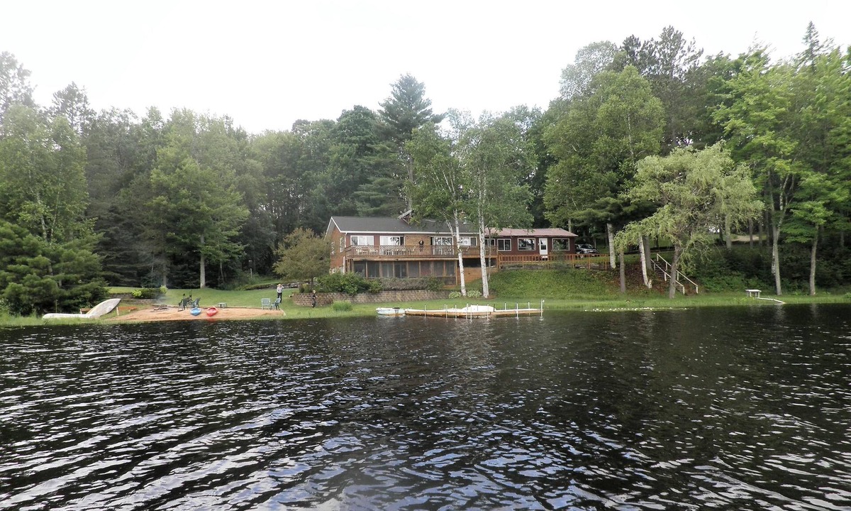 Rapid River Cabin | SECLUDED LODGE WITH ONE OF THE LARGEST PRIVATE STOCKED LAKES IN MICHIGAN.