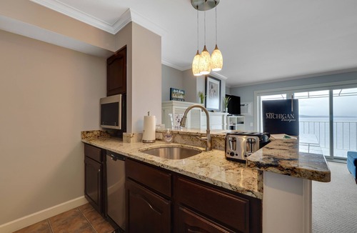Boyne City Condo | 209 Water Street | Lake Charlevoix Views | Private Balcony + Beach Access