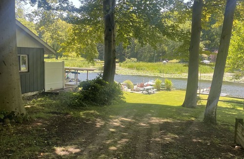 Ludington Cottage | #8 cottage comes with boat docks and shares over 600’ of frontage on Hamlin lake