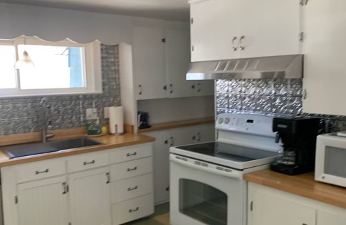 Ludington House | Adorable, “ Beach View Cottage” Lake Michigan views! Best location!