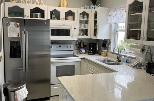 Clipper Cove Cottage | BEACH COTTAGE 3BR , GOLF CART W/HOUSE, PORCH SWING ,POOL 30 STEPS AWAY, PETS LOV