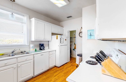 Audubon Place Condo | Bright duplex with two full kitchens, large decks, and private washer/dryers