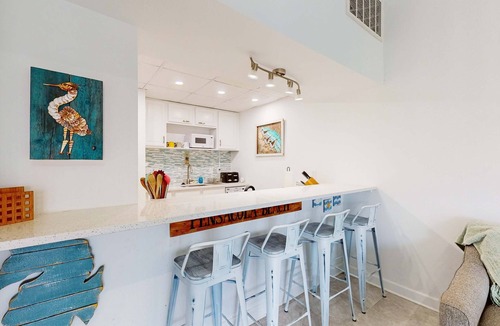 Villa Sabine Condo | Charming coastal condo with water views, great location, balcony, WiFi, A/C