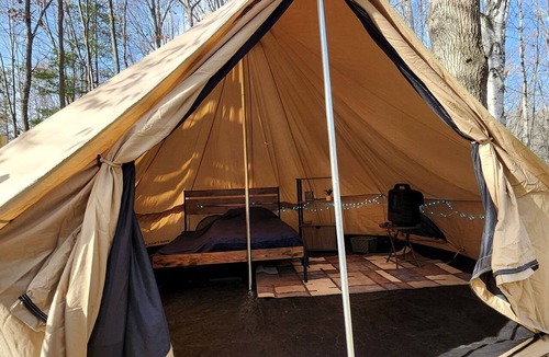 Mio RV Rental | Cozy Bell Tent Glamping on Private Fenced Deck with Bathhouse Firepit WiFi and Trails in Mio, Michigan