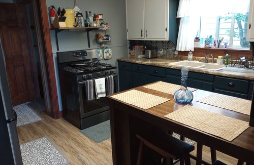 Ishpeming House | Cozy corner lot will provide a comfortable space for a couple or small family.