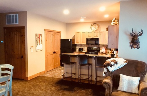 Boyne City Condo | Creekside Condo w/private hot tub at Boyne! Ski-in/Ski-out, Golf, Bike, Swim
