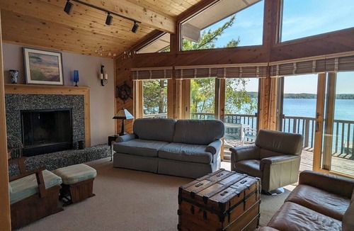 Beulah House | Direct Crystal Lake sandy swimming home. Kayaks, dock, firepit, AC. Dog ok