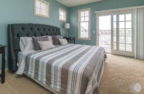Saugatuck Condo | Discover comfort in Saugatuck at Lake Street Townhome #7, a 3BR retreat with pool views.