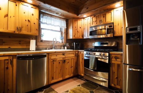 Petoskey House | Family Cabin - Indoor Hot Tub, Rec Room, Rock Wall, Indoor Swingset, Arcade