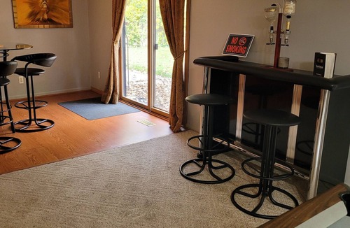 Southfield House | Fun House 2 with a Pool table on main floor game room with walk out patio door.