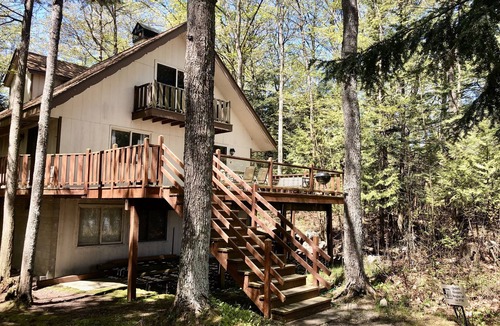 Traverse City House | House on sandy beach in Omena. Budget friendly. Dog ok. Sunrise views.