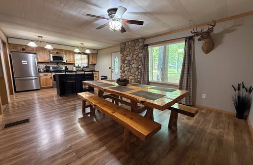 Prudenville Cabin | Knotty by Nature! Firepit and Parking! Less than a mile to trails and the lake!