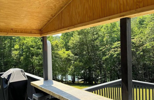Big Creek House | Lake Front Property with a gentle path to a private dock and the lake. 3bd 2 ba