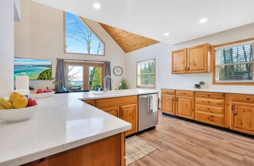 Higgins Lake House | Lake View Fully Stocked Family Retreat - Paddleboards, Firepit, Games, EV outlet