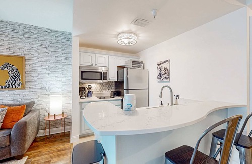 Sunnyside Apartment | Lakefront resort condo with heated outdoor pool, hot tub, balcony, lake views