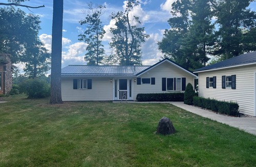 Newaygo Cottage | Lakefront Retreat near Dragon Trail! Big Dock, Patio, Views & More!