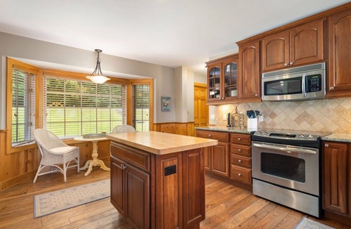 Kewadin House | Lakefront Torch Lake Home - Cottage Feel w/5 BR and Over 4K Sq Ft, Private Dock