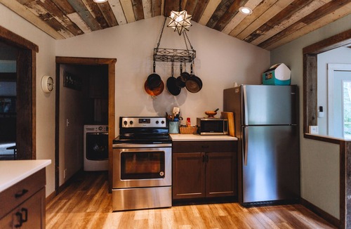 Riverside Cottage | Little Blue Cottage - wooded getaway, near beaches and towns