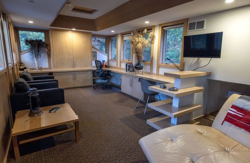 Midland House | Mid-Century Modern Retreat on Private 10 Acres with 1-Acre Pond & Nature Trails.