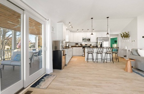 Beulah House | Modern-coastal retreat with lake views, covered deck, and walkable downtown Beulah location.