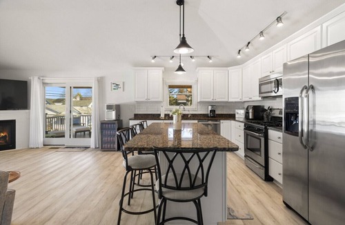 Beulah House | Modern-coastal retreat with lake views, covered deck, and walkable downtown Beulah location.