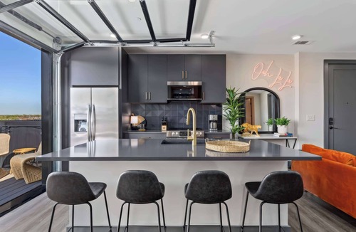 Rolling Mill Hill Apartment | Nashville getaway: 2 downtown homes, rooftop deck, sleeps 14 near Broadway