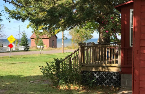 Laurium Cottage | NORTHERN LIGHTS! Historic Storybook Beach Cottage at Tamarack Waterworks