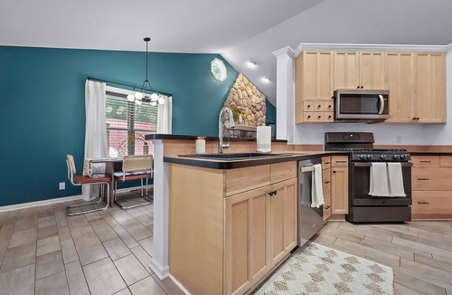 South Boardman House | Peaceful Lakefront Retreat w/Hot Tub, Fire Pit, Game Room, Screened Deck