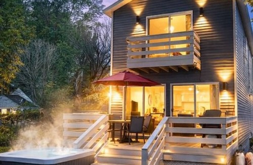 Norton Shores House | PONTOON BOAT NOW INCLUDED! KAYAKS! Waterfront Cottage on Mona Lake with HOT TUB!