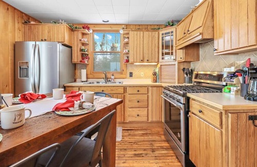 Presque Isle Cabin | Private Lakefront Stay with Beautiful Sunset Views, Kayaks, & Kid’s Area