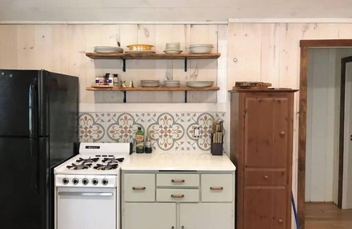 Ludington Cottage | Remodeled lakefront cottage w/marina, firepit, swimming area.