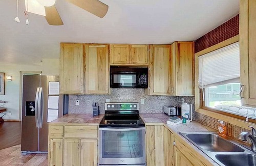 Onekama House | Remodeled, waterfront home on Portage Lake with dock & firepit - 2 dogs OK