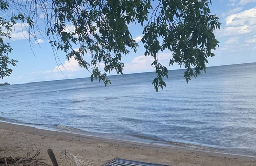 Menominee Cottage | Reserve for Spring and Summer 2023 to enjoy the SAND beach on Green Bay.