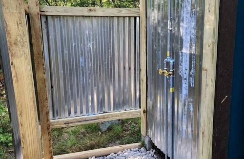 Bitely House | Rustic Converted School Bus with Outdoor Shower Near ORV Trails in Manistee National Forest, Michigan