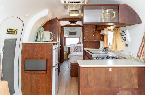 Selma House | Secluded airstream w/river and bridge views, large deck, & tiny house