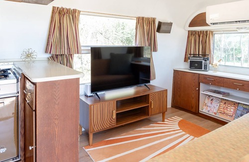 Selma House | Secluded airstream w/river and bridge views, large deck, & tiny house