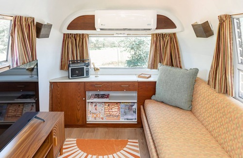 Selma House | Secluded airstream w/river and bridge views, large deck, & tiny house