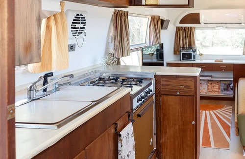 Selma House | Secluded airstream w/river and bridge views, large deck, & tiny house