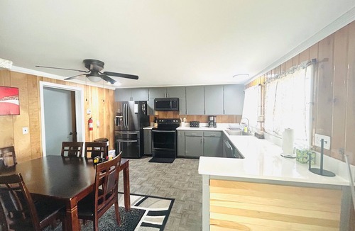Alpena House | Spacious 4-bedrooms lake front retreat in delightful Alpena area.