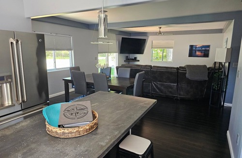 Alden House | Spacious home near Torch Lake w/custom back patio, steps away from public access
