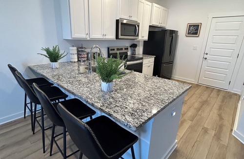 Normal House | Spacious Stay with 2-Car Garage & Multiple TVs