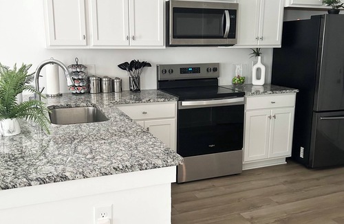 Normal House | Spacious Stay with 2-Car Garage & Multiple TVs