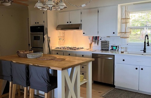 Hubbard Lake House | Spacious vacation home on large private wooded lot on crystal clear Hubbard Lake
