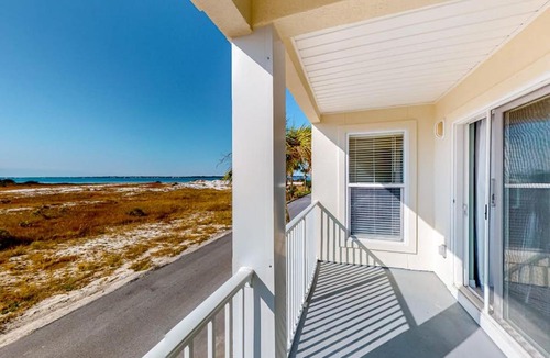 Navarre Beach House | Sunny coastal condo with pool balcony & sound view - walk to the beach