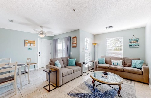 Navarre Beach House | Sunny coastal condo with pool balcony & sound view - walk to the beach