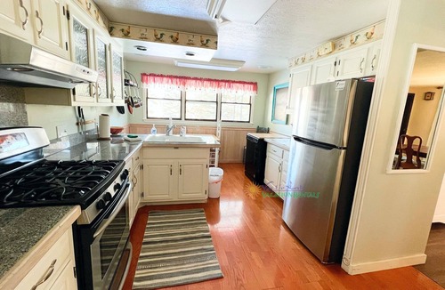Suttons Bay House | Suttons Bay farmhouse-style home. Five bedrooms. Air conditioning. Dog okay