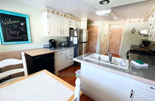 Suttons Bay House | Suttons Bay farmhouse-style home. Five bedrooms. Air conditioning. Dog okay