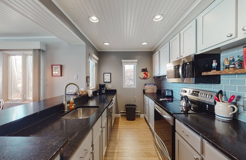 Maple City Condo | Tasteful Glen Arbor condo with beautiful Lake Michigan views, deck & fireplaces