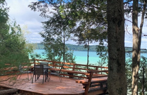 Alden Cottage | Torch lake waterfront:100 ft of sandy beach, 3-bedroom, 3-bath cottage